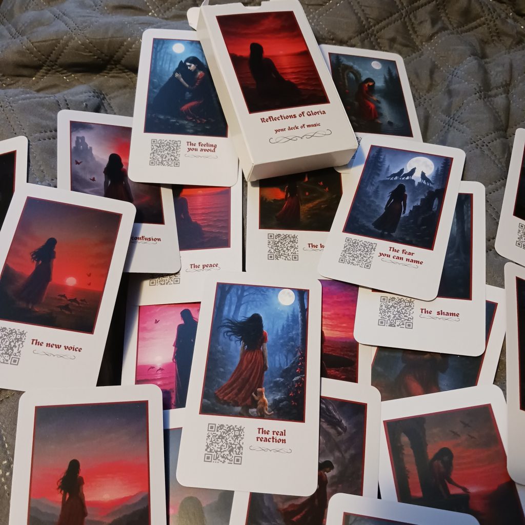 Reflections of Gloria card deck showing illustrated cards with QR codes